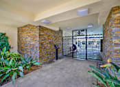 Thumbnail 11 of 19 - the entrance to a building with a gate at Olive Tree Apartments, California