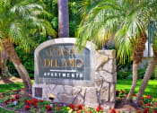 Thumbnail 13 of 36 - a sign for the casa del amo apartments in front of palm trees at Casa Del Amo Apartments, Torrance, 90505