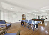 Thumbnail 13 of 54 - a game room with a ping pong table at Camino de Oro Apartments, California, 90505