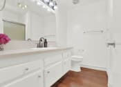 Thumbnail 38 of 54 - a bathroom with a sink and a toilet in it at Camino de Oro Apartments, Torrance, CA, 90505