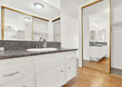 Thumbnail 30 of 36 - a bathroom with a sink and a mirror at Casa Del Amo Apartments, Torrance, CA