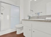 Thumbnail 32 of 36 - a bathroom with a sink and a toilet and a shower at Copa Ladeene Apartments, Torrance, CA 90505