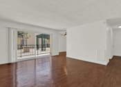 Thumbnail 22 of 26 - the living room and dining room with wood flooring and a balcony at Copa Triana Apartments, Torrance, 90505