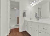 Thumbnail 21 of 26 - a bathroom with a sink and a mirror at Copa Triana Apartments, Torrance