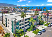 Thumbnail 1 of 18 - an aerial view of a building with palm trees and the ocean in the background  at Royal Towers Apartments, Redondo Beach, 90277