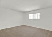 Thumbnail 15 of 18 - a spacious living room with white walls and a window at Royal Towers Apartments, Redondo Beach, CA, 90277