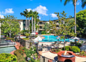 Thumbnail 2 of 55 - a view of a swimming pool at the resort on a sunny day at Willow Tree Apartments, California