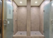 Thumbnail 20 of 55 - a large shower with two glass doors in a bathroom at Willow Tree Apartments, Torrance, CA, 90505