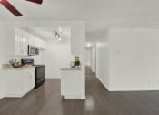 Thumbnail 24 of 55 - a kitchen with white cabinets and a counter top at Willow Tree Apartments, Torrance, CA