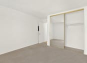 Thumbnail 34 of 36 - an empty room with white walls and a sliding glass door at Casa Del Amo Apartments, Torrance, CA 90505