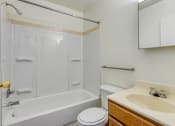 Thumbnail 10 of 10 - a bathroom with a sink toilet and a tub