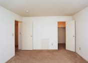 Thumbnail 16 of 25 - a group of white men standing in a room with white doors