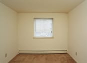 Thumbnail 2 of 25 - the upstairs bedroom has a large window and beige walls