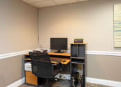 Thumbnail 3 of 25 - an office with a computer and a chair
