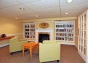 Thumbnail 17 of 25 - a living room filled with furniture and a fireplace
