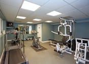 Thumbnail 20 of 25 - a fitness room with weights and other exercise equipment