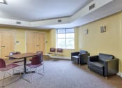 Thumbnail 11 of 14 - a waiting room with chairs and a table