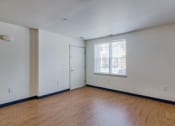 Thumbnail 11 of 11 - an empty living room with white walls and a window