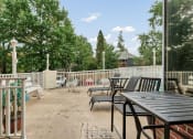 Thumbnail 10 of 10 - a patio with tables and chairs and a fence