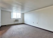 Thumbnail 8 of 10 - an empty room with white walls and a window