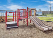 Thumbnail 2 of 15 - a playground with a slide and other play equipment