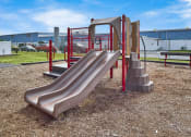 Thumbnail 5 of 15 - a slide on a playground at a school
