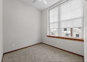 Thumbnail 5 of 50 - A room with a window and a ceiling fan.