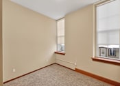 Thumbnail 11 of 50 - Empty room with a window on the right side.