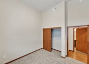 Thumbnail 15 of 50 - A room with a white wall and a white fridge.