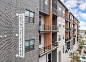 Thumbnail 50 of 52 - Apartment building with a sign that says Annex on the Square.