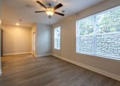Thumbnail 2 of 65 - A room with a ceiling fan and a window with blinds.