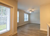Thumbnail 9 of 65 - A room with a ceiling fan and a window with blinds.