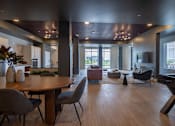 Thumbnail 61 of 65 - A modern living room with a wooden floor and furniture.