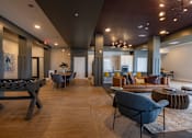 Thumbnail 60 of 65 - A modern living room with a pool table and comfortable seating.