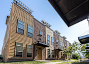 Thumbnail 12 of 14 - Building with a sidewalk in front of it at 7th Street Brownstones, Indigo Living, Iowa