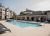 Thumbnail 27 of 51 - A large swimming pool surrounded by lounge chairs and buildings.at 92West, West Des Moines, 50266  