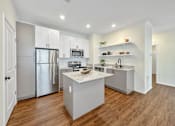 Thumbnail 35 of 51 - a large kitchen with stainless steel appliances and white cabinets at 92West, West Des Moines, 50266  