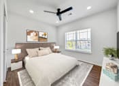 Thumbnail 4 of 51 - a bedroom with a bed and a ceiling fan at 92West, Iowa  