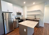 Thumbnail 7 of 51 - a kitchen with stainless steel appliances and granite counter tops at 92West, West Des Moines, 50266  