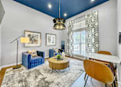 Thumbnail 16 of 51 - a living room with a couch and a table at 92West, West Des Moines, 50266  