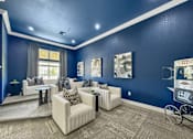 Thumbnail 19 of 51 - a living room with blue walls and white couches and chairs at 92West, West Des Moines, 50266  