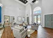 Thumbnail 11 of 51 - a living room with couches and a table at 92West, West Des Moines, IA  