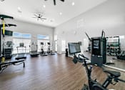 Thumbnail 23 of 51 - the residence apartments fitness room with weights and cardio equipment at 92West, West Des Moines, IA  