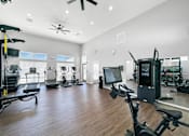 Thumbnail 37 of 51 - the residence apartments fitness room with exercise equipment at 92West, West Des Moines  
