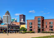 Thumbnail 19 of 23 - a view of the city from a parking lot at Ballyard Lofts, Indigo Living, IA, 50309