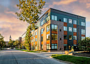 Thumbnail 22 of 27 - a modern building with a street in front of it at Canary Lofts, Des Moines