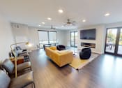 Thumbnail 15 of 27 - a living room with a couch and a television at Canary Lofts, Iowa, 50311