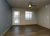 Thumbnail 5 of 20 - Living room with a ceiling fan and wooden flooring at Cedarbrooke Place , Norwalk, 50211