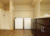 Thumbnail 6 of 20 - Laundry room with a washer and dryer at Cedarbrooke Place , Norwalk