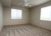 Thumbnail 7 of 20 - Carpeting In Bedrooms with a ceiling fan at Cedarbrooke Place , Norwalk, Iowa